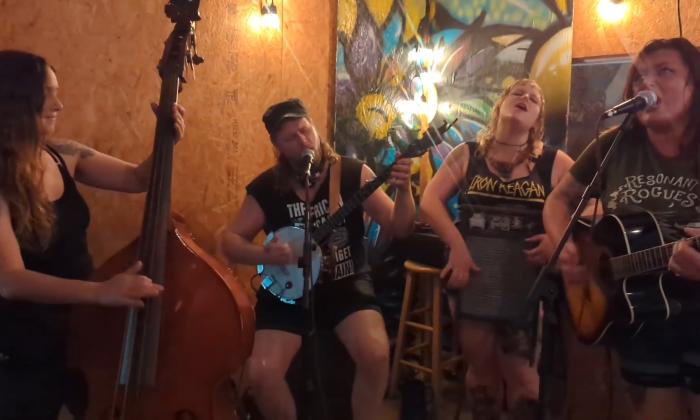 The band singing at a local venue