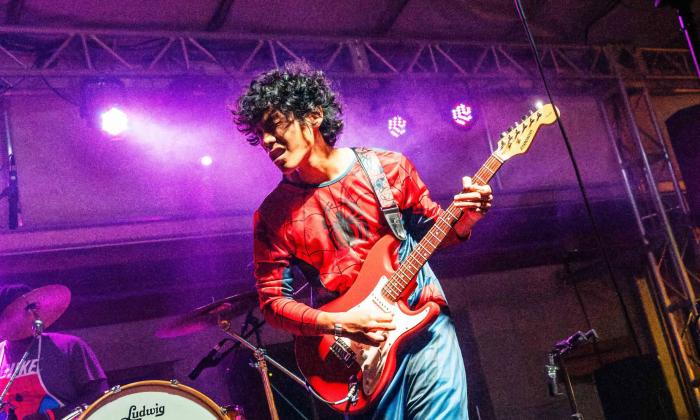 Buboy on stage with his guitar