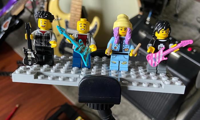 The musicians in the band Doubleside, depicted in Legos