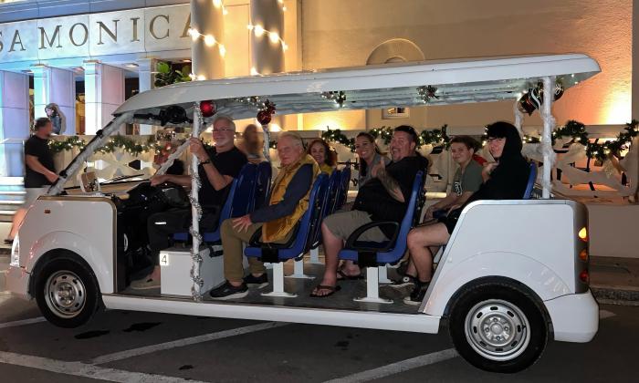 The 10-passenger Pineapple Tours electric vehicle loaded with Nights of Lights guests