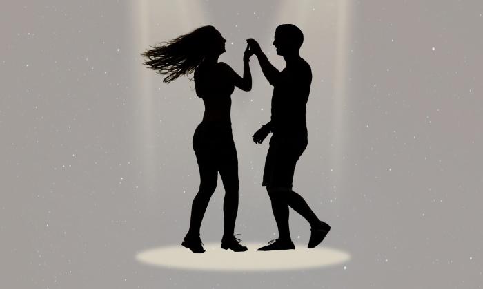 Partners rumba dancing together