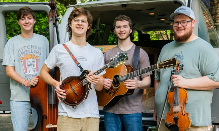Bandmates from Mountain Grass Unit pose with their musical instruments.