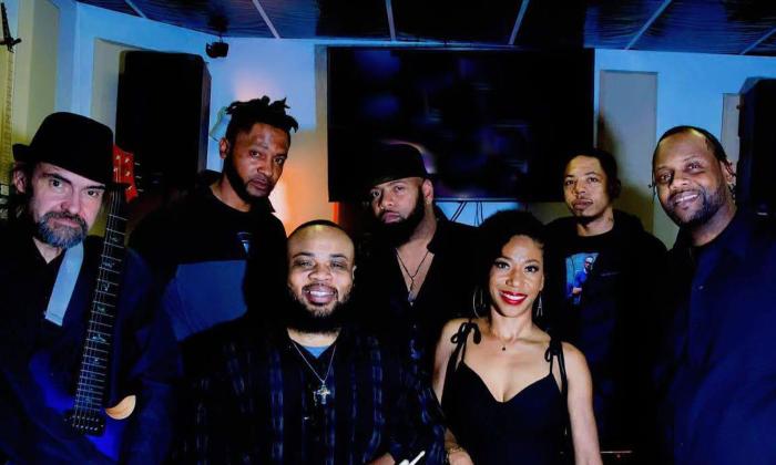 The band Soulfull Roots standing together onstage