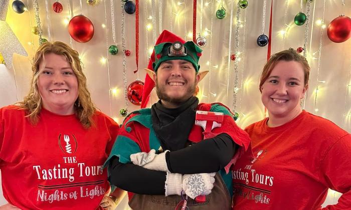 The elf Lumpa Coal, standing with the crew of Tasting Tours