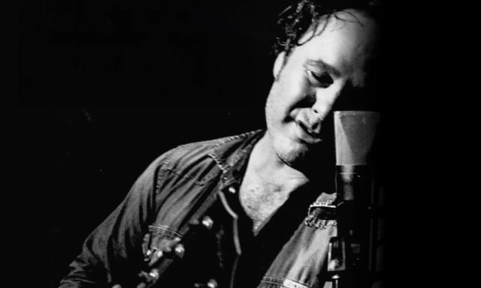 Martin Sexton closes his eyes and lets the music pour out across the stage.