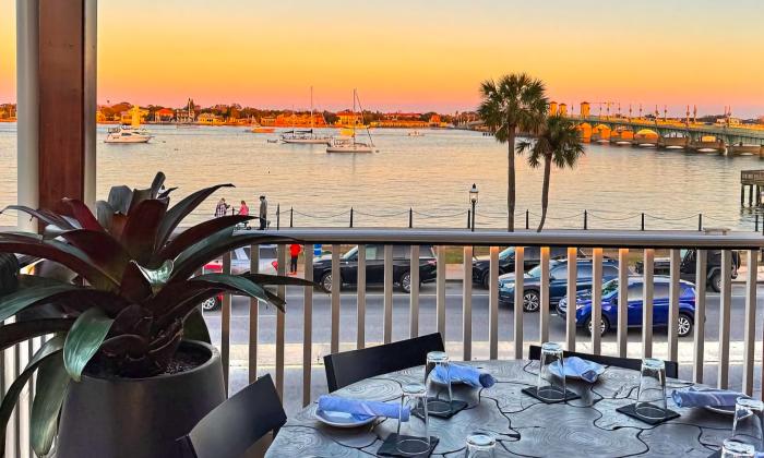 A table on the balcony of Saint restaurant, overlooking the Matanzas River