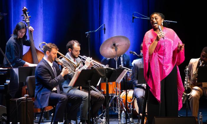 Samara Joy performing on stage with her band