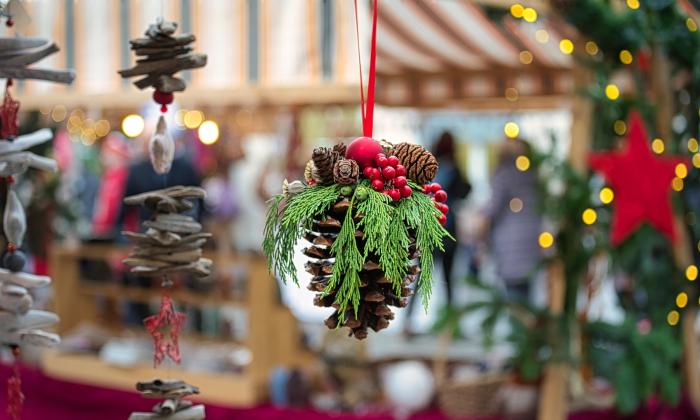 Holiday pinecones hanging at a market