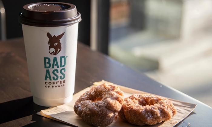 Malasada donuts and a cup of hot coffee