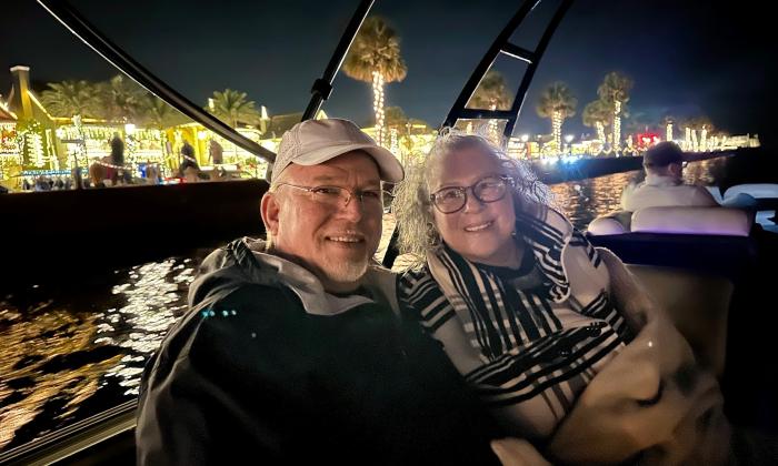 A couple aboard a Gone2Sea Boat Rentals pontoon boat for the Nights of Lights
