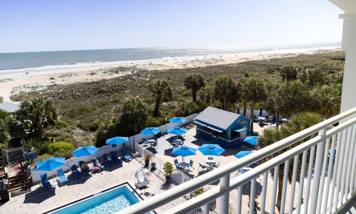 The Tiki Bar and the beach viewed from an upper deck at Guy Harvey Resort