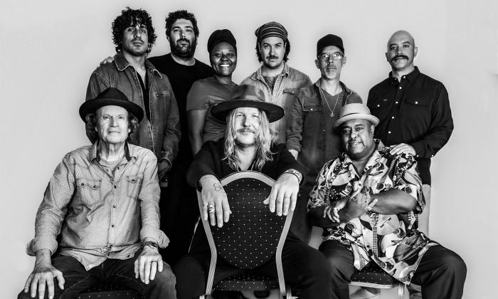 Devon Allman poses with Jimmy Hall and other artists from the Blues Summit. 