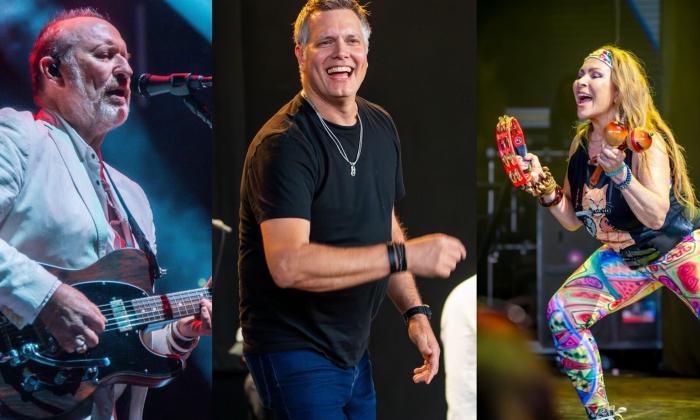 Bandmates from Men at Work perform on stage.