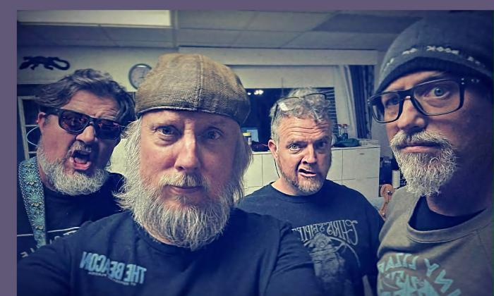 The four members of Cosmoshead, looking fierce