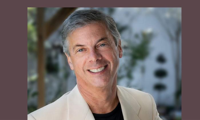 Curtis Tucker, artistic director of First Coast Opera outside in front of trees