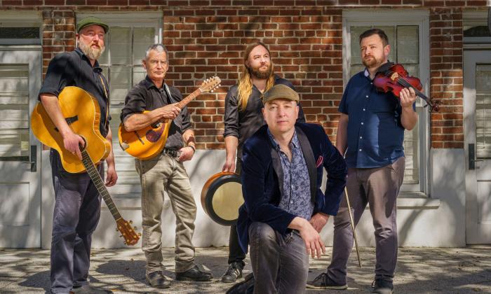 The five core members of the Steel City Rovers, outside in the sun