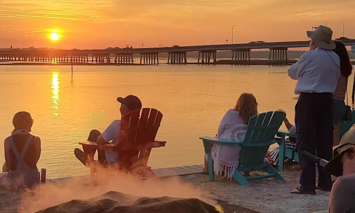 Oysters roasting, while folks enjoy the sunset over the Matanzas River