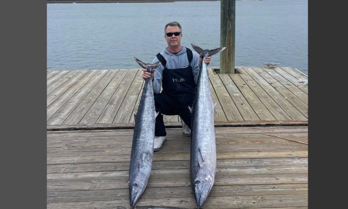 An angler showing the wahoo he caught during the 2025 Round-up
