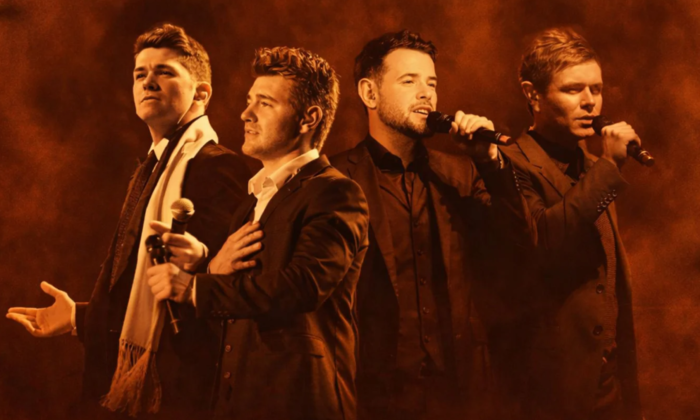 Bandmates from Celtic Thunder sing in front of a brown backdrop.