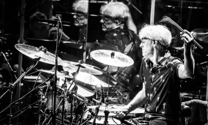 Stewart Copeland performs on stage with his drums.