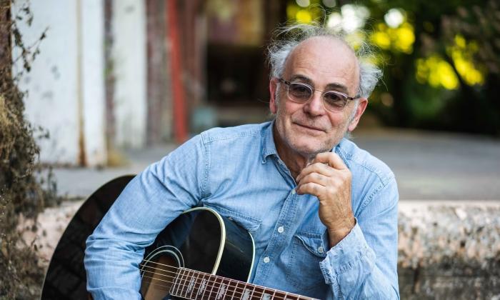 Ed Snodderly outside with his guitar