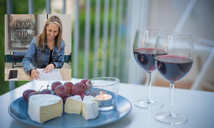 Wine and cheese on a table with an insert of an author signing a book