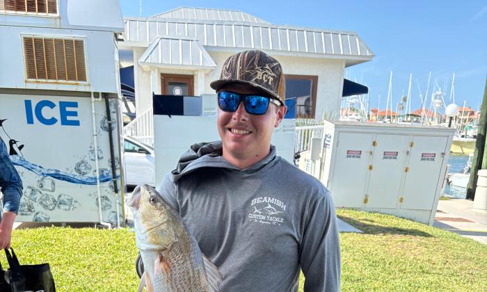 An angler with a large fish caught at the SAHS inshore fishing tournament