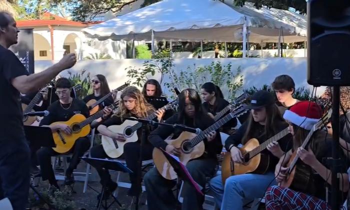 Young guitarists performing in a classical guitar ensemble