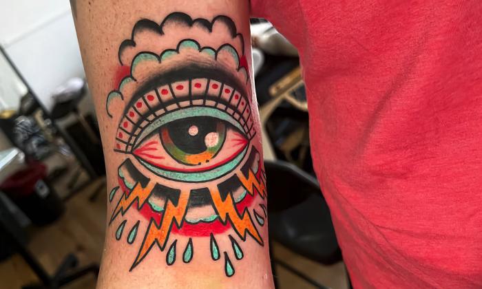 A colorful, abstract eye tattoo