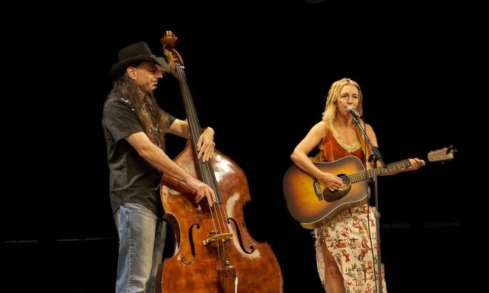 The two core members of Gypsy Strings Revial, the gentleman on upright bass and the lady on guitar