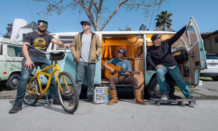 The Expendables in front of a VW bus