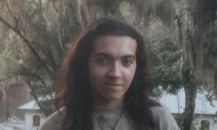 Gainesville musician Alex Willow standing outside