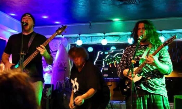 Metal band Zalongo onstage, performing