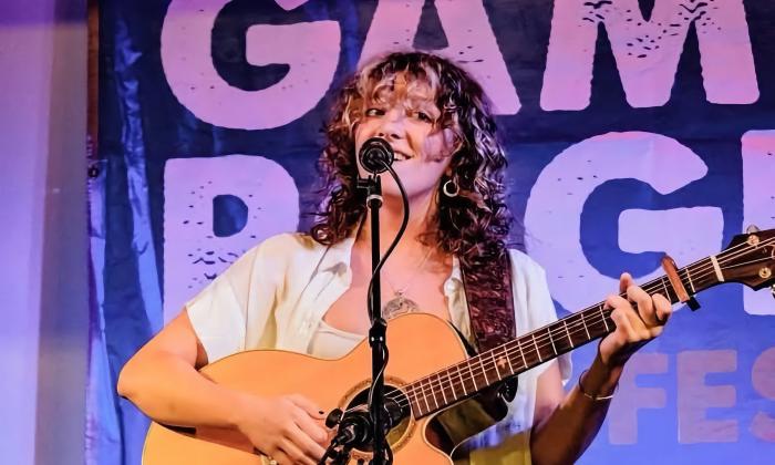 Eloise Arnold on stage at the Gamble Rogers Festival YoungFolk concert
