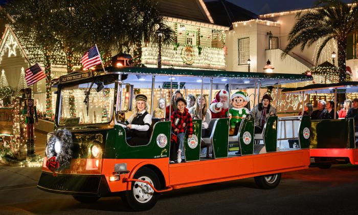 An Old Town Trolley decorated for Nights of Lights with special guests aboard, inluding Santa