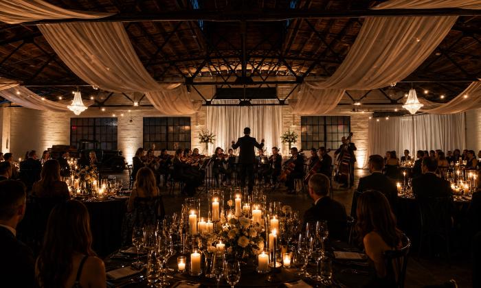 A live orchestra performing inside The Venue