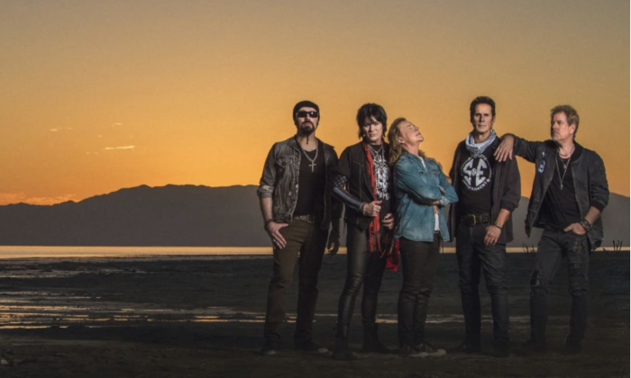 Bandmates from Night Ranger pose in front of a scenic backdrop.