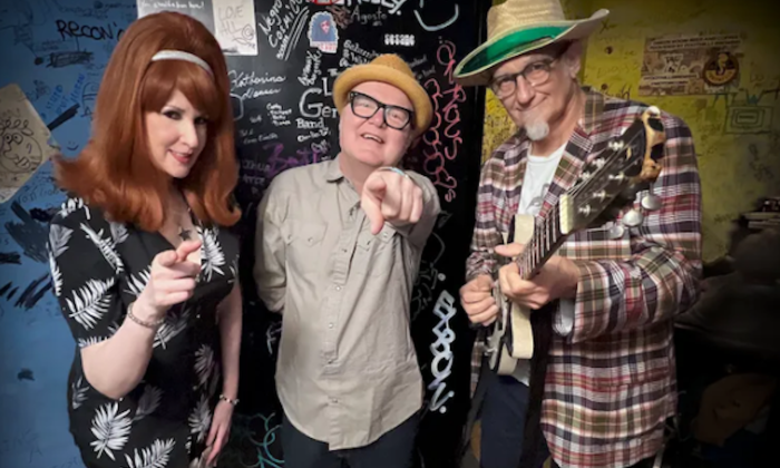 Bandmates from Southern Culture On The Skids smile and pose for fans.