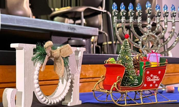 Three symbols of the holiday season, used as decor for a concert