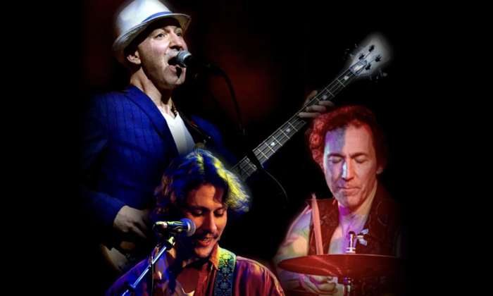 Bandmates from Sons of Cream perform on stage in front of a black backdrop.