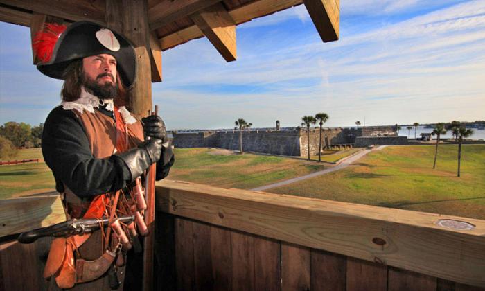 A guard standing in the watchtower of the Colonial Quarter.
