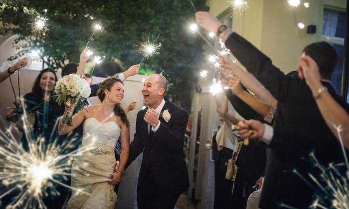 Sparklers provide the lighting as this bride and groom celebrate their wedding in St. Augustine. Photo by Rob Futrell.