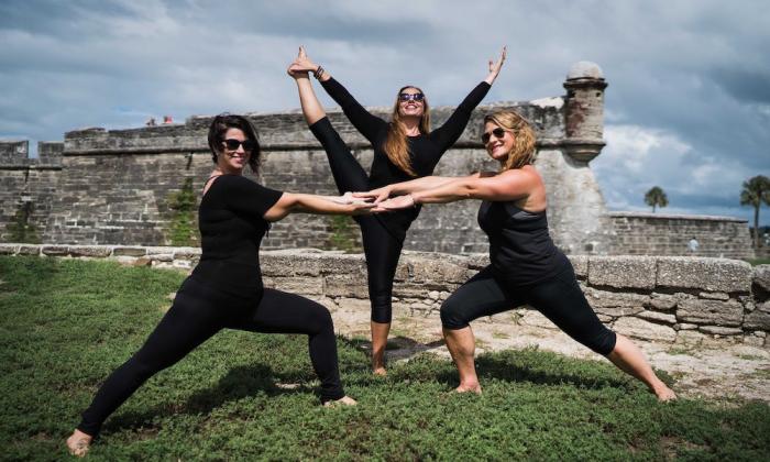 Yoga session in front of the Castillo de San Marcos with The Pilates Yoga Loft in St. Augustine, FL