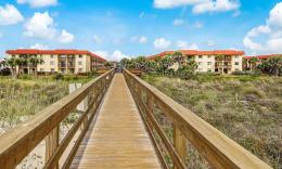Looking from the beach entrance, back along the private-entry boardwalk toward St. Augustine Ocean & Racquet Resort