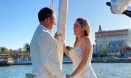 This bride and groom are reciting their vows on a vessel from St. Augustine Sailing, with the bayfront in the background