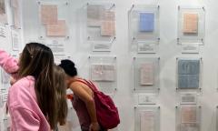 Visitors looking at historical documents at the Karpeles Museum