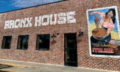 The brick exterior of Bronx House Pizza