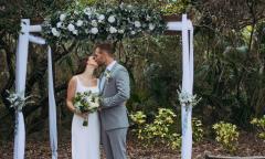 Newlyweds kissing after their ceremony