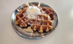 Leige waffles with whipped cream on top