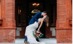A bride and groom kissing at Flagler College